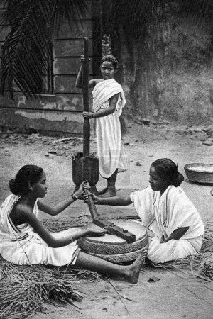 Photo for Old vintage photo of bengali girl grinding rice bengal calcutta India - Royalty Free Image