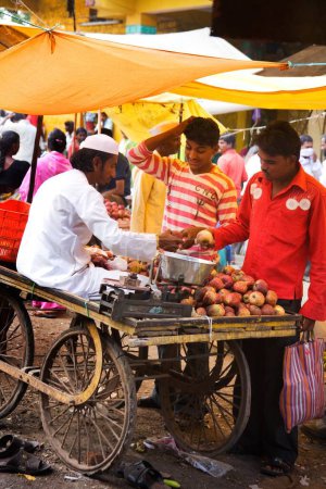 Photo for Man selling fruits in market, Nandur, Marathwada, Maharashtra, India - Royalty Free Image