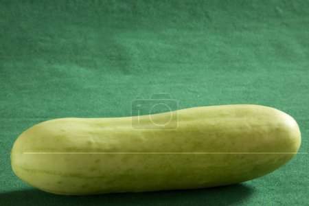 Photo for Green vegetable , Cucumber Kakdi on green background - Royalty Free Image