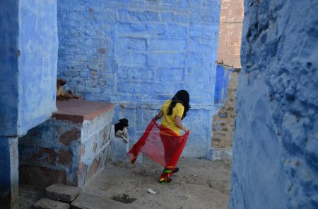 Photo for Young girl walking in narrow lane, jodhpur, rajasthan, India, Asia, - Royalty Free Image