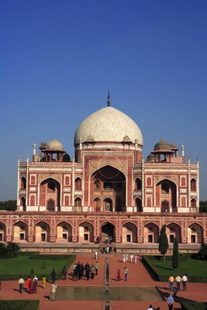 Photo for Tourists at Humayun's tomb built in 1570 made from red sandstone and white marble first garden-tomb on Indian subcontinent persian influence in mughal architecture, Delhi, India UNESCO World Heritage Site - Royalty Free Image