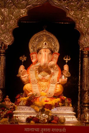 Photo for Richly decorated idol of Lord Ganesh ; elephant headed God of Hindu worshiping for Ganapati festival ; Tambadi Jogeshwari ; second in honour at Pune ; Maharashtra ; India - Royalty Free Image