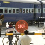 Crossing on railway track showing stop board , India