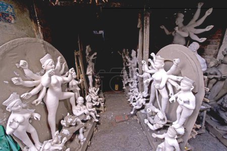 Photo for Clay model of goddess Durga with her consorts in process of complete ; Calcutta ; West Bengal ; India - Royalty Free Image