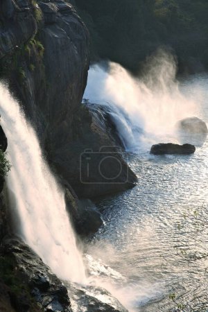 Picnic spot ; landscape Athirappilly waterfall gushing water spray ; District Thrissur ; Kerala ; India