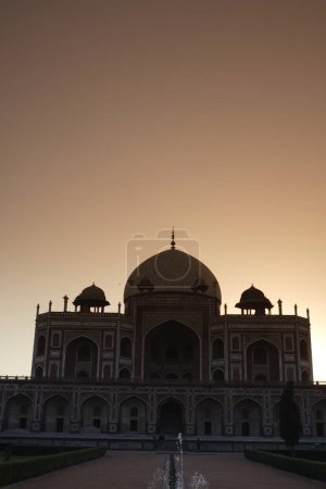 Sunrise at Humayun's tomb built in 1570 made from red sandstone and white marble first garden-tomb on the Indian subcontinent persian influence in mughal architecture , Delhi , India UNESCO World Heritage Site