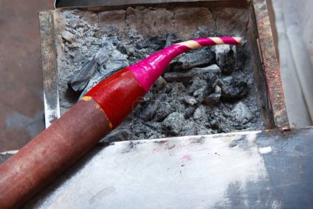 Photo for Heating wax for bangle ; Jodhpur ; Rajasthan ; India - Royalty Free Image