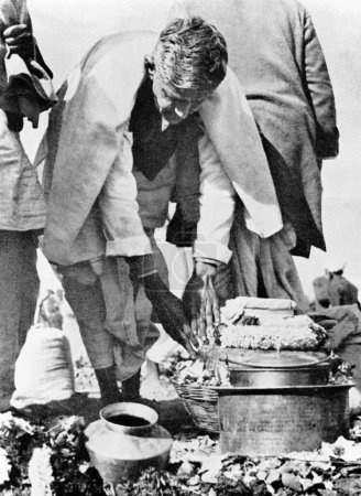 Photo for Ramdas Gandhi handling the urn carrying his fathers ashes at Allahabad, Uttar Pradesh, India, February 12, 1948 - Royalty Free Image