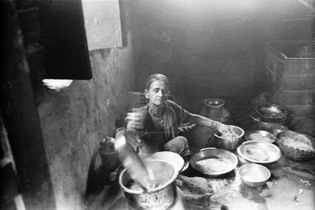 Photo for Women working in kitchen, Modnib, Maharashtra, India - Royalty Free Image