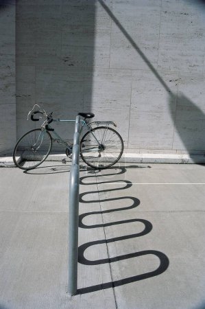 Bicycle at wall ; New York; U.S.A. United States of America