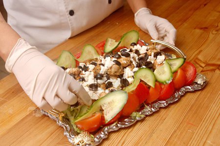 Photo for Non vegetarian food ; Cold chicken filed platter (Marinated chicken filed baked and served with feta cheese and olives garnished with tomato and cucumber) ; Model Release 468 - Royalty Free Image
