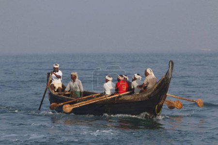 Photo for People boating, kovalam beach, kerala, India, Asia - Royalty Free Image