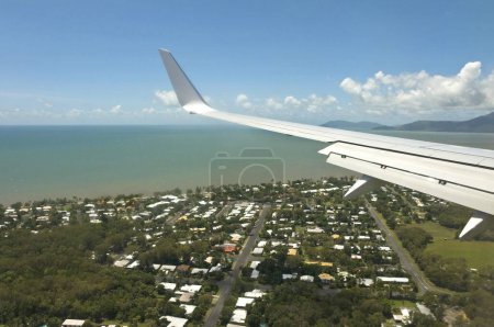 Photo for Aerial view of airplane approaching Cairns city, Queensland, Australia - Royalty Free Image