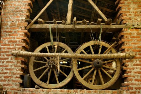 Photo for Two bullock cart wheels ; Murud Janjira coast ; District Raigad ; Maharashtra ; India - Royalty Free Image