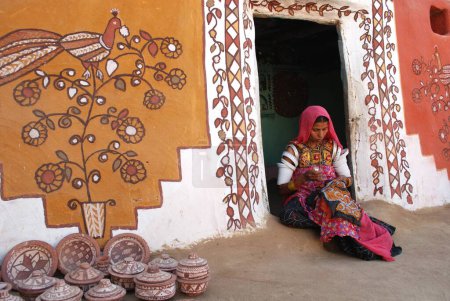 Photo for Lady doing embroidery work on cloth, Khuri Khuhri, Jaisalmer, Rajasthan, India - Royalty Free Image