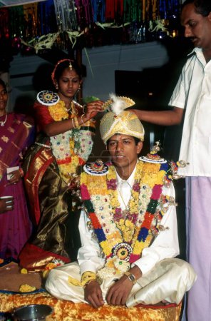 Photo for Bride and bridegroom performing vidhi, sequence of Nattukottai chettiar (Nagarathar) family, tamil nadu, india - Royalty Free Image