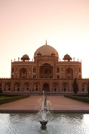Sunrise at Humayun's tomb built in 1570 made from red sandstone and white marble first garden-tomb on the Indian subcontinent persian influence in mughal architecture , Delhi , India UNESCO World Heritage Site