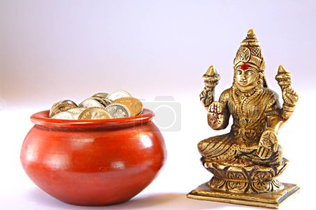 Photo for Indian goddess shree Lakshmi , goddess of good fortune , lustre and wealth , pot with coins , India - Royalty Free Image