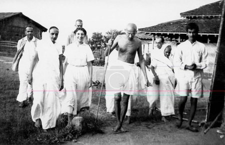 Photo for Balwant Singh presents a newborn four hours old calf to Mahatma Gandhi and others at Sevagram Ashram , 1940 - Royalty Free Image