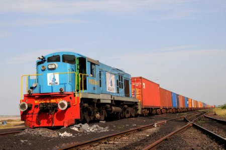 Photo for Goods containers with train engine at Adani Power ; Mundra ; Kutch ; Gujarat ; India - Royalty Free Image