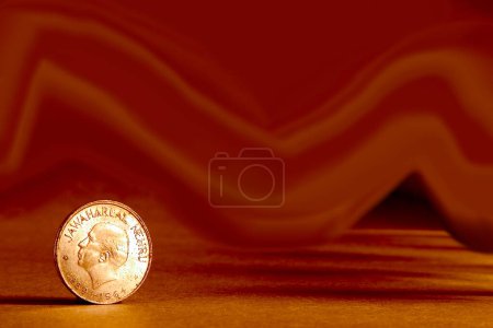 Photo for One single Indian currency one rupees coin and artistic background backside embossed Jawaharlal Nehru 1889-1964 - Royalty Free Image