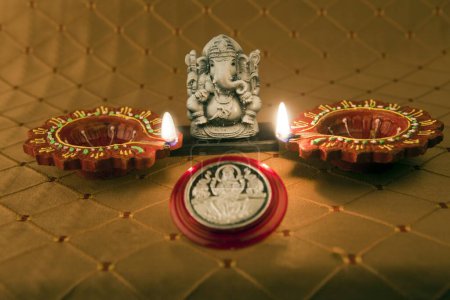 Ganpati idol with earthen oil lamps diwali festival Mumbai Maharashtra India Asia