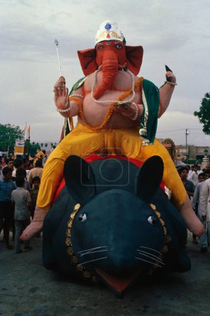 Photo for Ganesh ganpati Festival ; Elephant headed God sitting on rat ; Mumbai Bombay ; Maharashtra ; India - Royalty Free Image