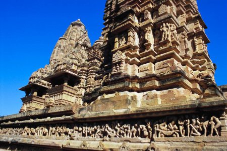 Row of statues and pinnacle of Lakshmana temple , Khajuraho , Madhya Pradesh , India