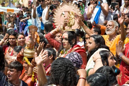 Photo for Laxmi narayan tripathi holding goddess idol on head, madhya pradesh, india, asia - Royalty Free Image