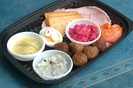 Christmas Plate (Jul Tallrik Sweden) with Mustered Sill fish , Onion marinated Sill Fish , Egg with cold crab sauce , Swedish Meet balls , Beetroot salad , Cooked Ham slice , Roasted Ham Slices , Smoked Salmon (Rokt Lax in Swedish) fish cheesee slice