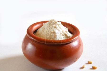 Photo for Maida , wheat flour in clay pot , India - Royalty Free Image