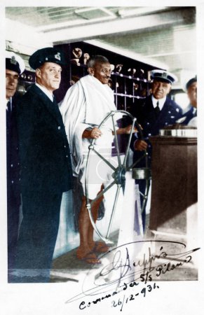 Photo for Mahatma Gandhi steering ship S S Pilsna on his return journey to India, December 26, 1931 - Royalty Free Image