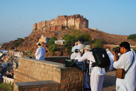 Photo for Foreign tourists taking shots of Mehrangarh, Jodhpur, Rajasthan, India - Royalty Free Image