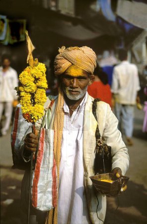 Photo for Devotee holding turmeric powder, jejuri, pune, maharashtra, india, asia - Royalty Free Image