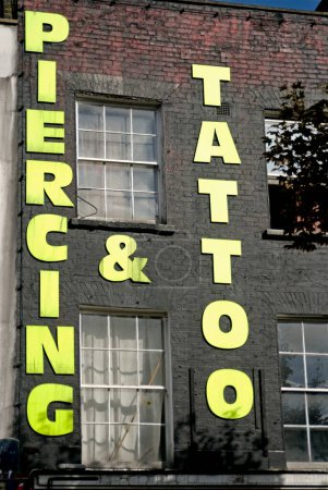 Photo for Piercing & Tattoo studio in Camden town market ; London ; U.K. United Kingdom England - Royalty Free Image
