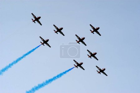 Photo for Indian Air Force helicopters demonstrating during an air show organized by the Air force at the Marine Drive in Bombay now Mumbai ; Maharashtra ; India - Royalty Free Image