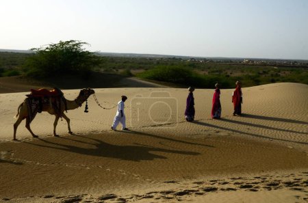 Photo for Women balancing water pots on head, Thar desert, Jaisalmer, Rajasthan, India, Asia - Royalty Free Image