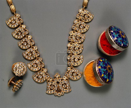 Photo for Necklace with small diamonds Earrings set and haldi kumkum pot - Royalty Free Image