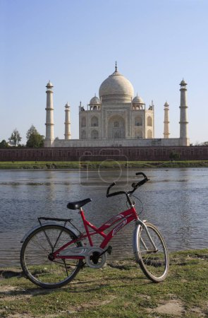 Photo for Bicycle at Taj Mahal Seventh Wonders of World on south bank of Yamuna river , Agra , Uttar Pradesh , India UNESCO World Heritage Site - Royalty Free Image