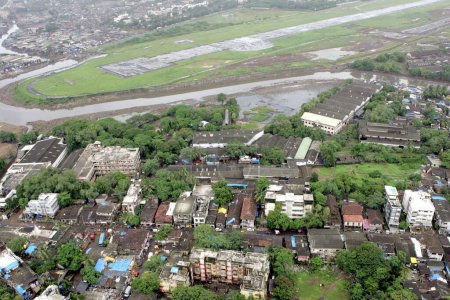 An aerial view of area surroundings runways also Mithi river flowing through airport area at Mumbais Chhatrapati Shivaji Maharaj International airport at Sahar ; Bombay Mumbai ; Maharashtra ; India 