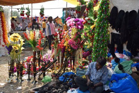 Photo for Plastic flowers vendor, Holi Festival, Goligadh, Navsari, Gujarat, India, Asia - Royalty Free Image