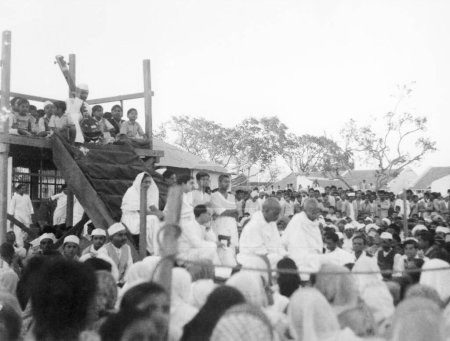 Photo for Mahatma Gandhi and Sardar Vallabhbhai Patel at a prayer meeting during Mahatma Gandhis fast at Rashtriyashala Ashram ; Rajkot ; March 1939  ; India - Royalty Free Image