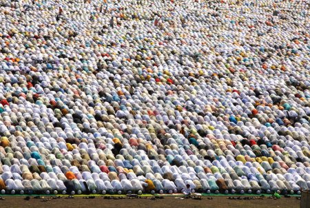 Photo for Crowd offering their Eid al Fitr or Ramzan id namaaz at Lashkar-e-Eidgaah ground, Malegaon, Maharashtra, India - Royalty Free Image
