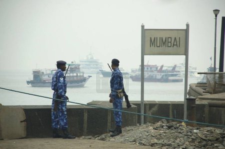 Photo for Rapid action force police keep watch coastal area after terrorist attack by deccan mujahideen, Bombay Mumbai, Maharashtra, India - Royalty Free Image