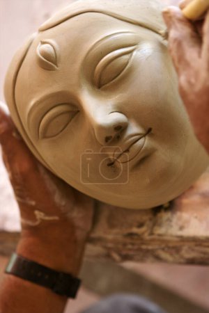 Photo for Incomplete goddess Durga sculpture made of clay for Durga Pooja celebration ; Rajkot ; Gujarat; India - Royalty Free Image