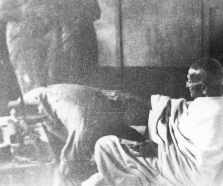 Photo for Mahatma Gandhi talking to two women, India - Royalty Free Image