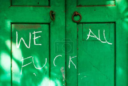 Photo for Written with chalk on green door, Calcutta, West Bengal, India - Royalty Free Image