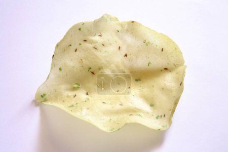 Deep fry papad poppadom made of lentil or cereal flours on white background