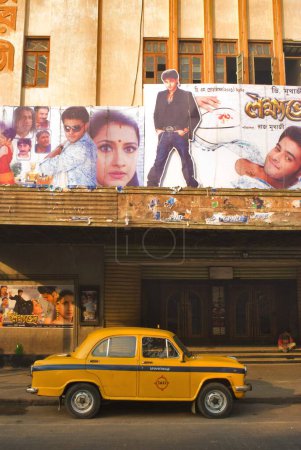 Photo for Taxi at purna cinema theatre screening bangla movies Bhowanipur, Calcutta Kolkata, West Bengal, India - Royalty Free Image