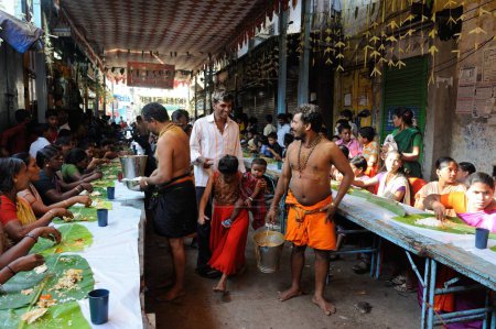 Photo for People eating meal Slum Dharavi Mumbai India Asia - Royalty Free Image